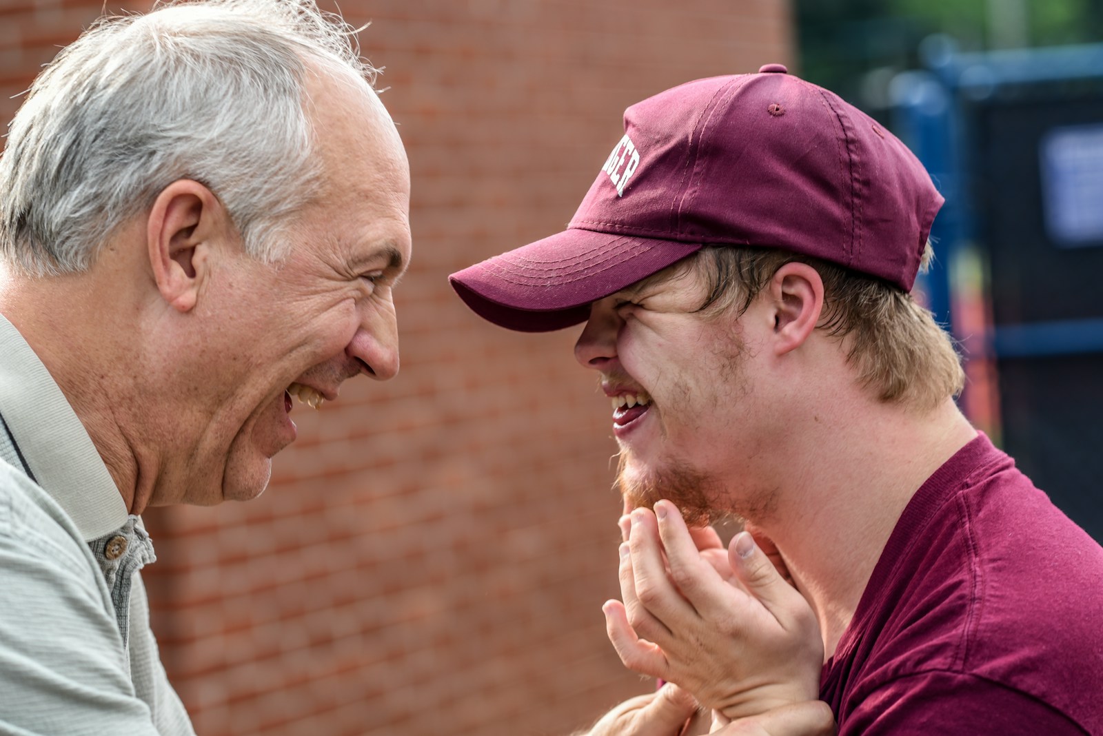 Photo by Nathan Anderson two man laughing at each other